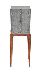 uniquely designed repurposed american industrial riveted joint steel cabinet with a newly added "danish modern" style four-legged tapered and turned base