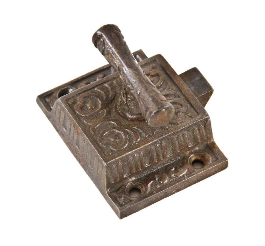 late 19th or early 20th century ornamental cast iron interior residential kitchen cabinet door latch with spring-loaded t-handle