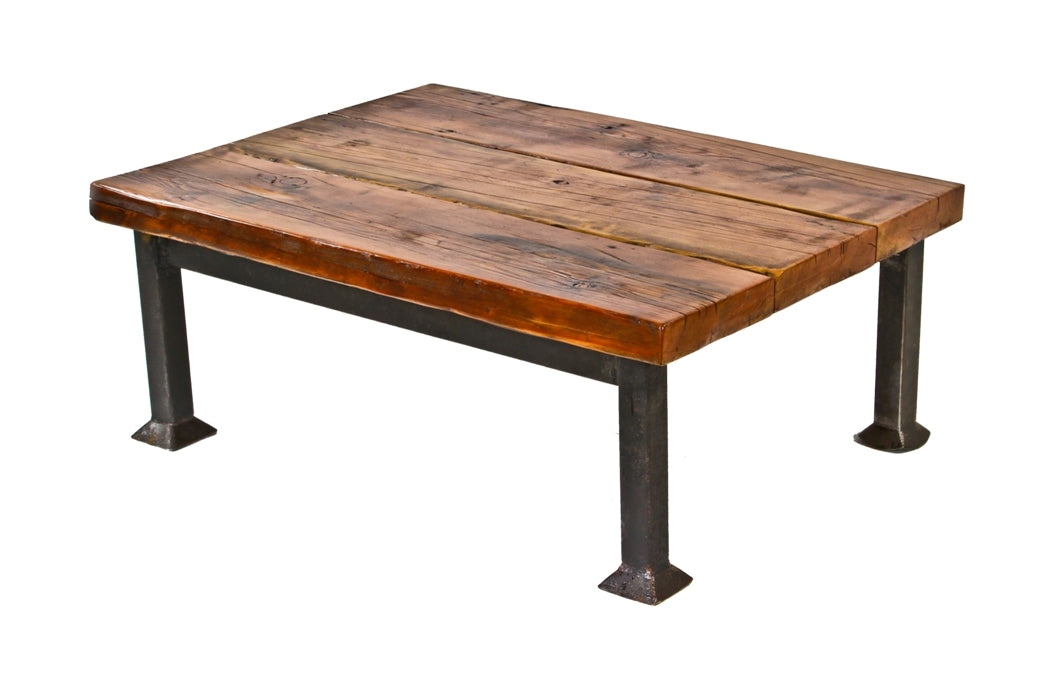 solidly built american industrial repurposed low-lying coffee table with a stationary four-legged square tubular steel base