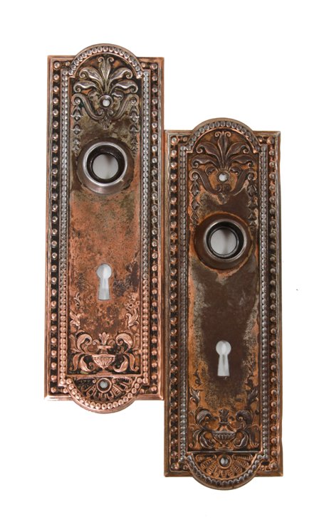 original c. 1900's american antique ornamental wrought steel "como" pattern copper-plated doorknob backplates with beaded borders