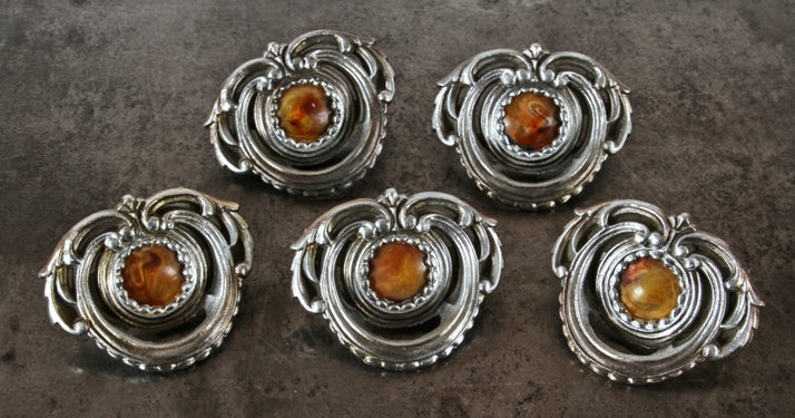 group of five matching original american depression era decorative "pot metal" furniture drawer pulls with circular-shaped bakelite insets