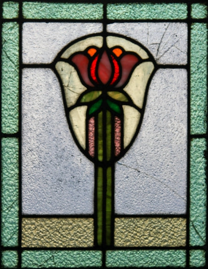 two of two original early 20th century arts & crafts style variegated textured leaded glass window with impressive floral motif