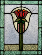 two of two original early 20th century arts & crafts style variegated textured leaded glass window with impressive floral motif