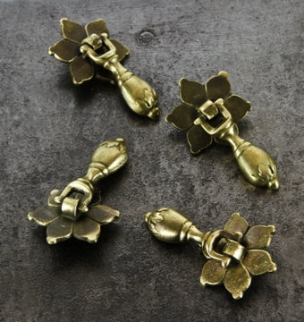 four matching c. 1920's american antique brushed brass "teardrop" style cabinet drawer pulls or handles with perforated backplates