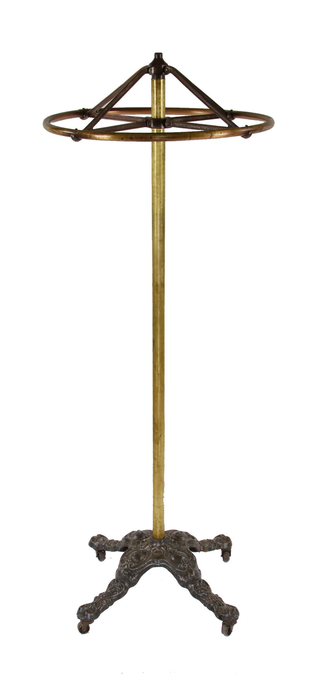 hard to find and highly desirable early 20th century completely intact clothing store garment rack with a heavily ornamented cast iron weighted base
