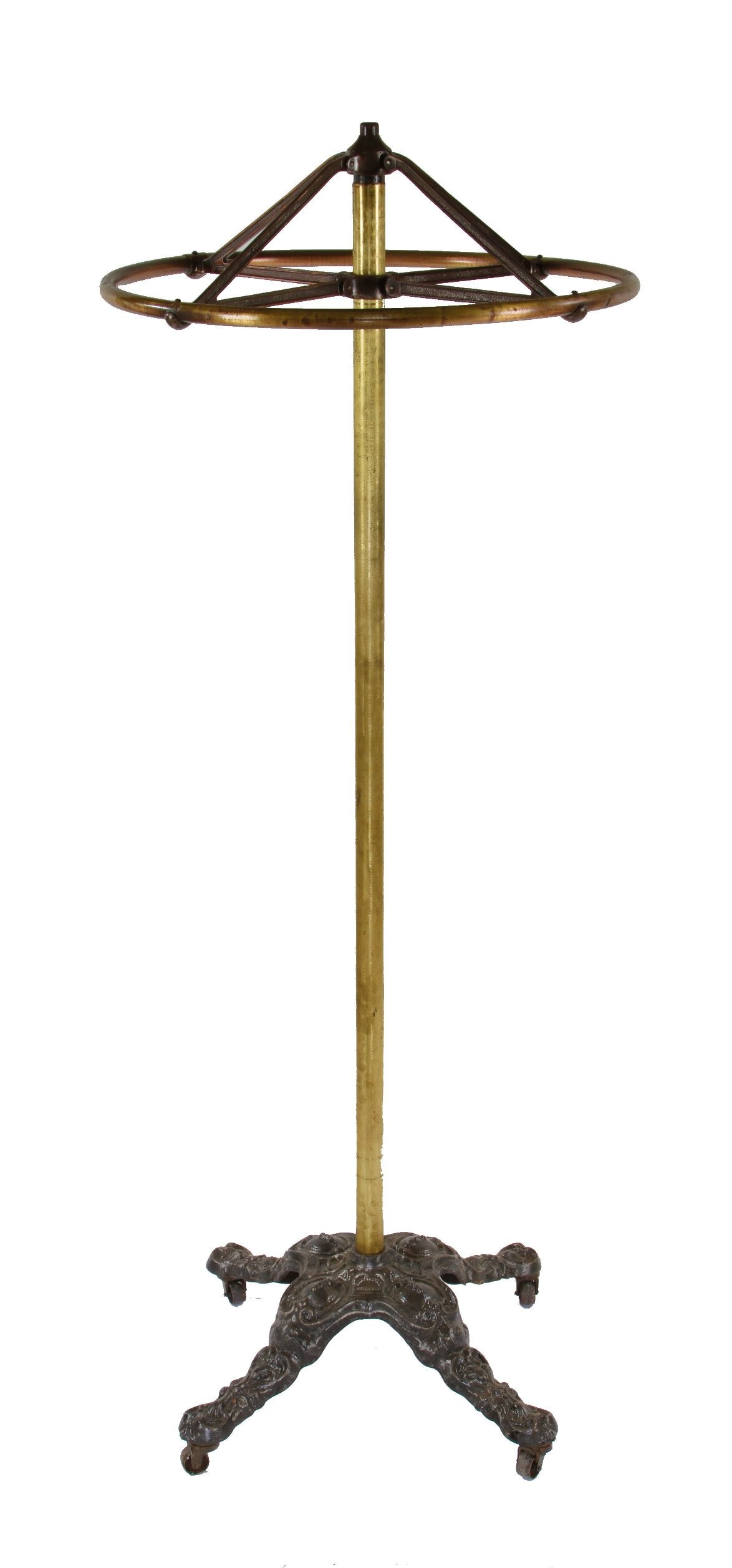 hard to find and highly desirable early 20th century completely intact clothing store garment rack with a heavily ornamented cast iron weighted base