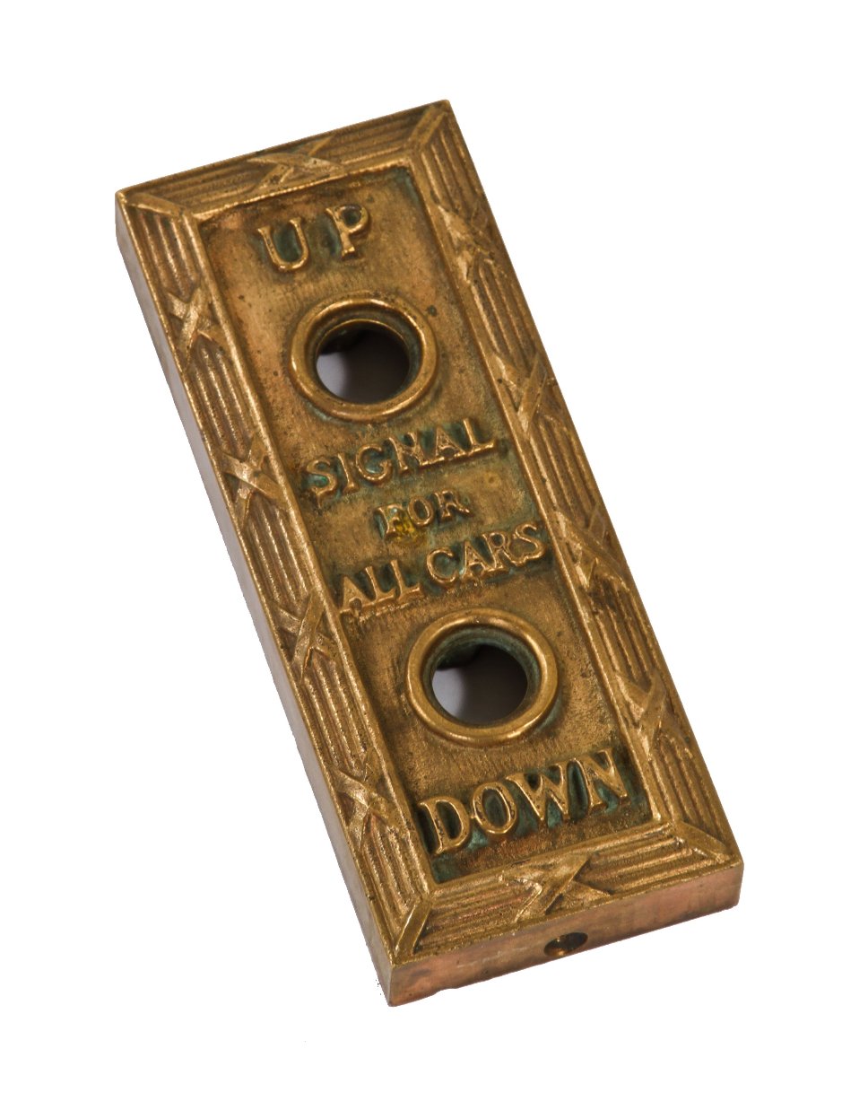 neoclassical style interior commercial building lobby surface-mount elevator car call push button backplate with reed and tie border