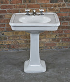 all original and intact interior residential freestanding white glazed vitreous porcelain or china lavatory pedestal sink with flared base