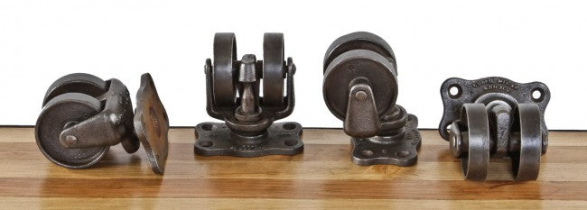lot of four matching late 1920's american antique industrial oversized heavily reinforced cast iron "roll-ezy chief" factory mobile cart double caster wheel trucks