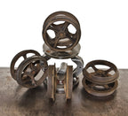 set of four matching 19th century interior residential cast iron improved "wilcox" sliding or pocket door cast iron spoked track rollers