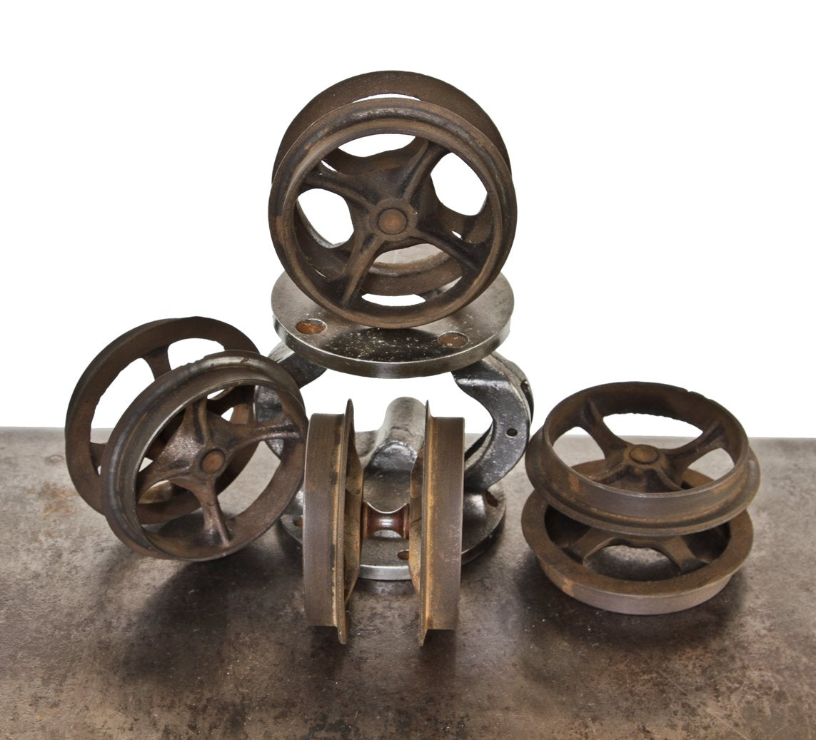 set of four matching 19th century interior residential cast iron improved "wilcox" sliding or pocket door cast iron spoked track rollers