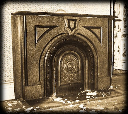 completely refinished brushed ornamental cast iron 19th century american victorian era interior residential fireplace mantel with original shelf