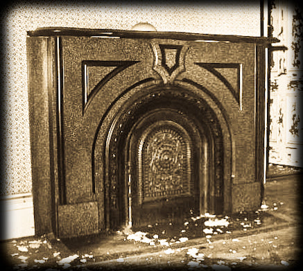 original 19th century black enameled ornamental cast iron arch top interior residential chicago italianate fireplace summer cover