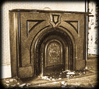 original 19th century black enameled ornamental cast iron arch top interior residential chicago italianate fireplace summer cover