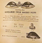 sought after original early 20th century american industrial yellow brass "benjamin" double plug cluster lamp socket adapter with nicely aged surface patina.