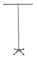 highly desirable c. 1910-20 original and intact american industrial commercial garment rack with four-legged cast iron base with claw feet