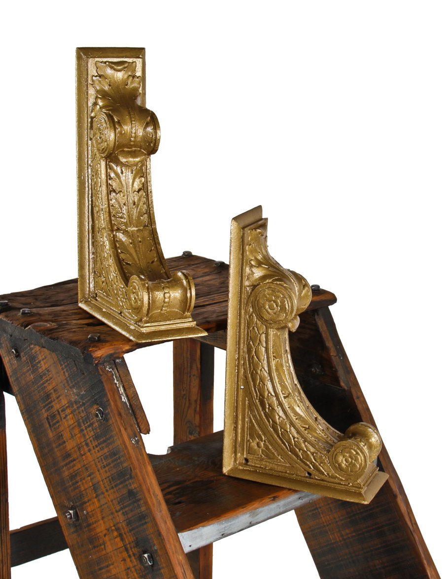 matching pair of c. 1920's original and intact interior chicago bank building neoclassical style ornamental cast iron corbels or brackets with metallic gold enameled finish