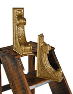 matching pair of c. 1920's original and intact interior chicago bank building neoclassical style ornamental cast iron corbels or brackets with metallic gold enameled finish