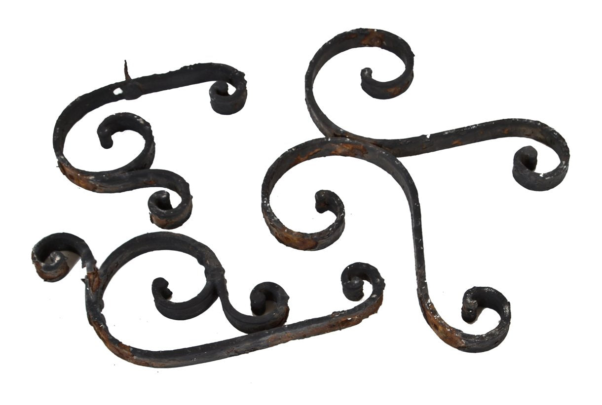 group of three late 19th century original ornamental wrought iron exterior residential window guard scrollwork fragments with black paint finish