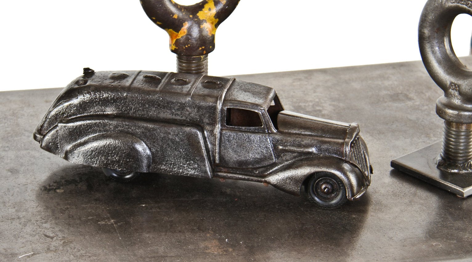 refinished antique american industrial c. 1920's brushed metal woodie-esque truck with original and intact hardened rubber wheels