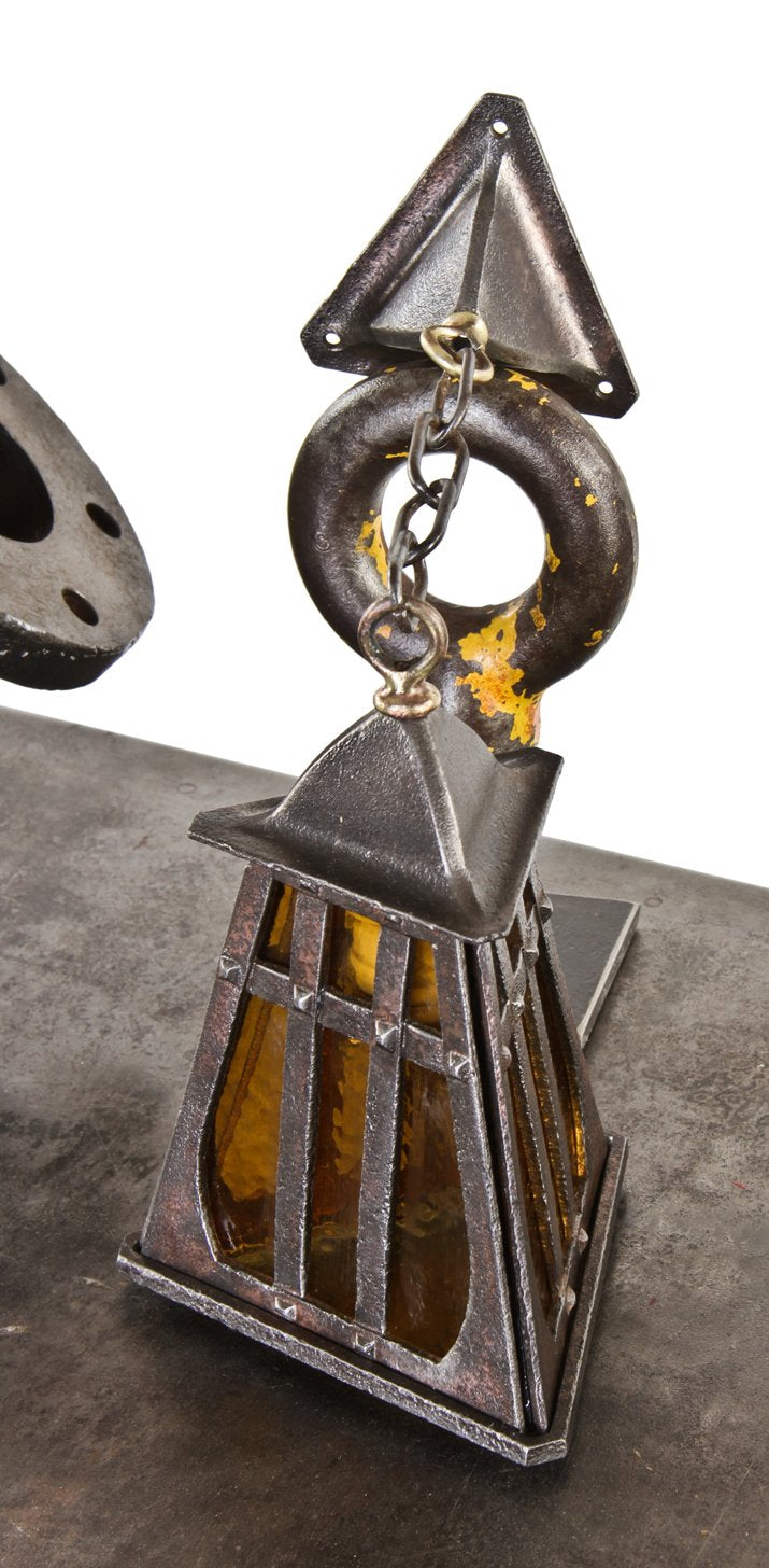 refinished early 1920's american craftsman or mission style ornamental iron residential pendant light fixture with amber art glass