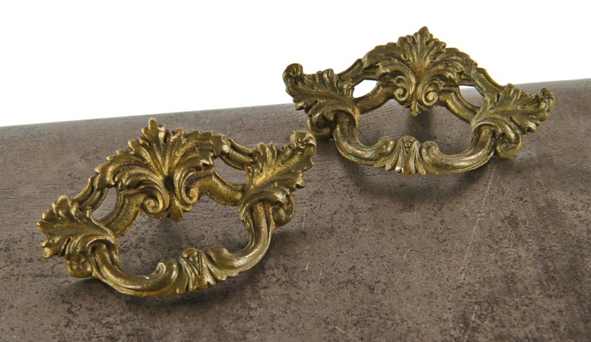 pair of early 1920's american ornamental cast brass interior residential built-in cabinet drawer pulls with abundant leafage