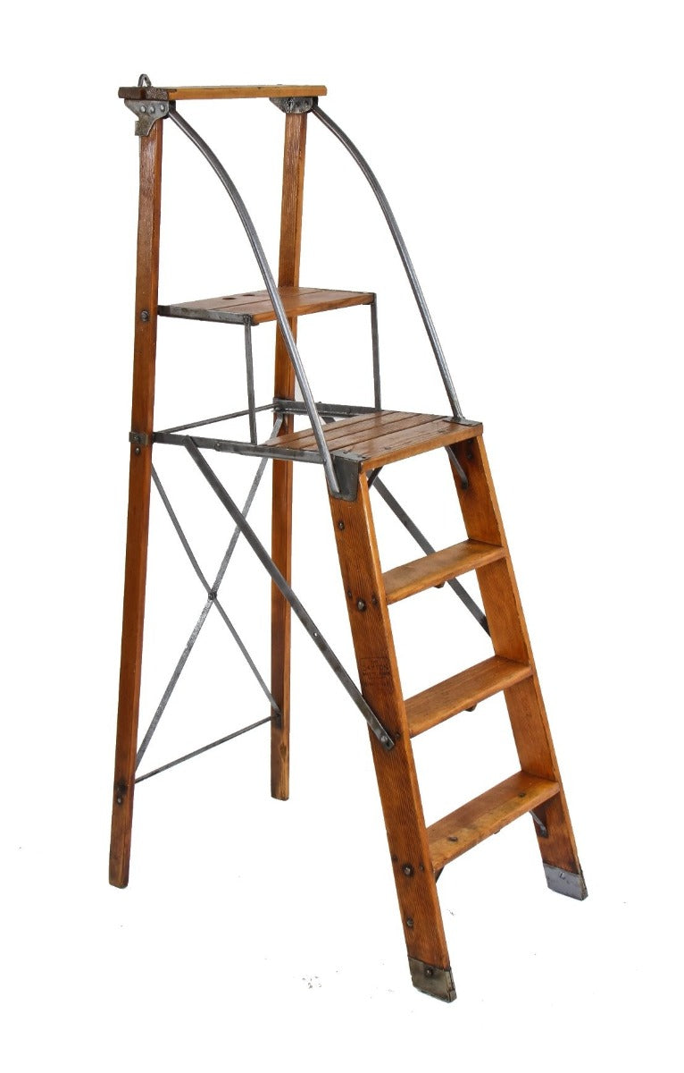 nicely worn and weathered original early 20th century antique american industrial "dayton" safety ladder with bassick casters