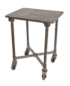 early 1920's brushed metal american industrial mobile four-legged print shop table with cast iron deck and casters