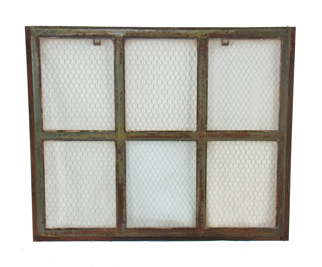 early 20th century hard to find original and intact six-pane "chicken wire" heavy gauge steel factory casement window with weathered green paint finish