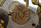 heavy cast bronze metal chicago ywca hotel building 7th floor key fob with double-sided numbers containing black enameled inlay