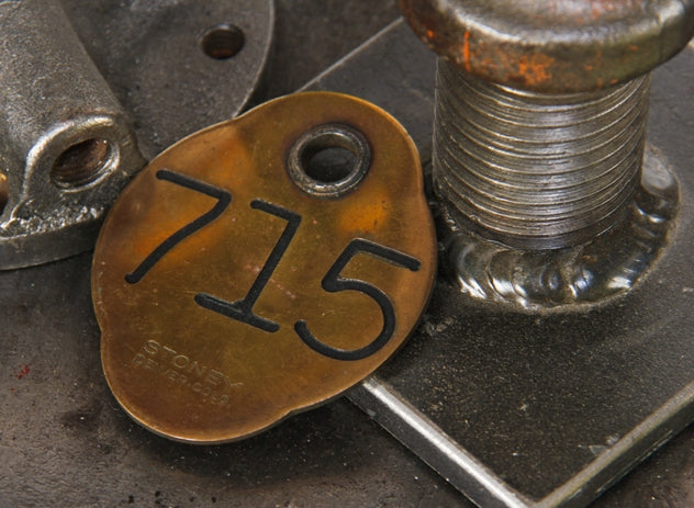 single antique american die cut bronze metal double-sided lightly incised chicago ywca hotel building door key fob