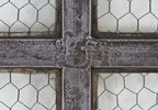 one of several hard to find and highly desirable heavily reinforced "chicken wire" sandwich glass factory casement windows with welded joint muntins