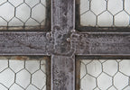highly sought after all original and intact c. 1905 heavily reinforced "chicken wire" sandwich glass industrial six-pane steel window