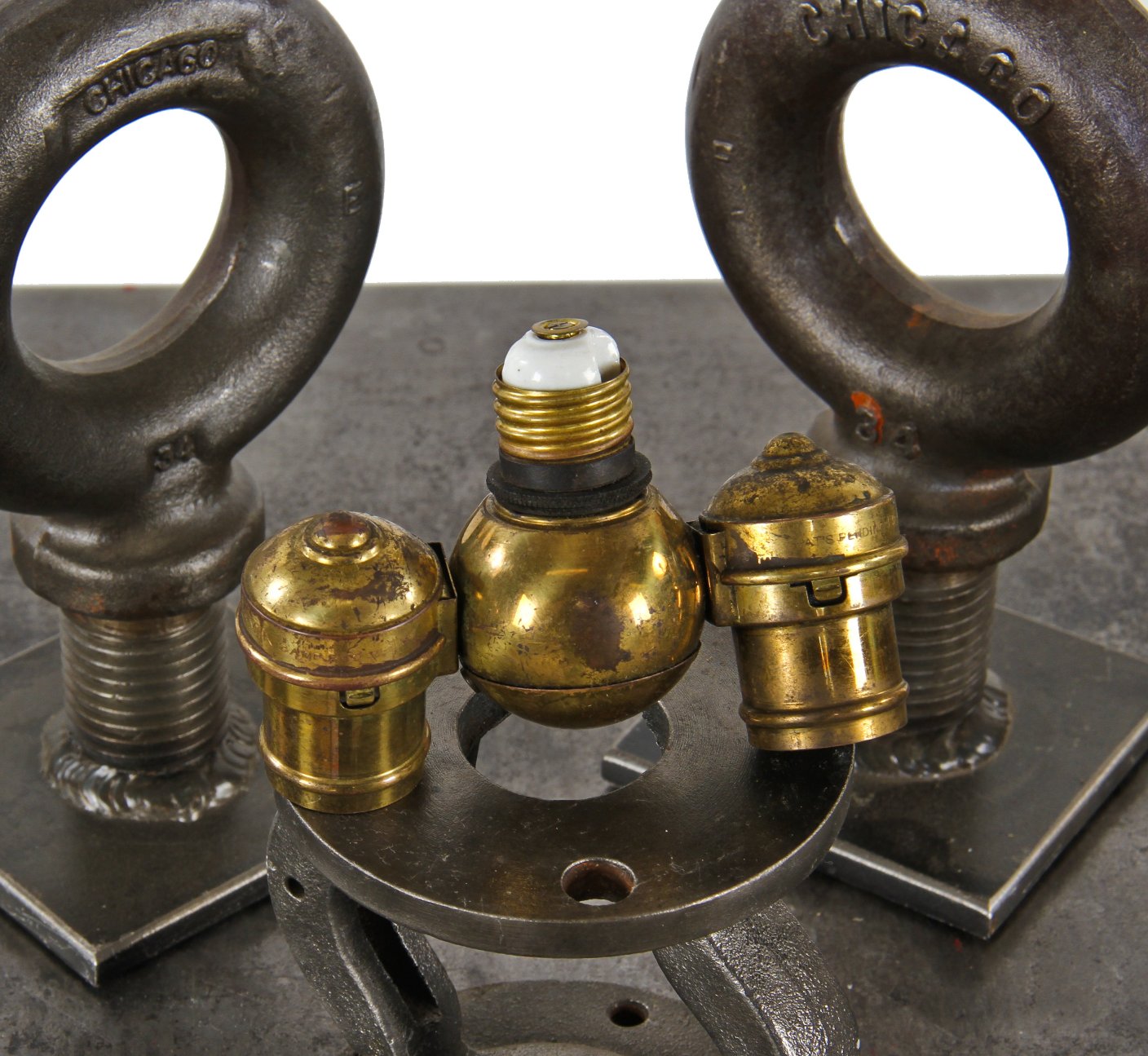 sought after original early 20th century american industrial yellow brass "benjamin" double plug cluster lamp socket adapter with nicely aged surface patina.