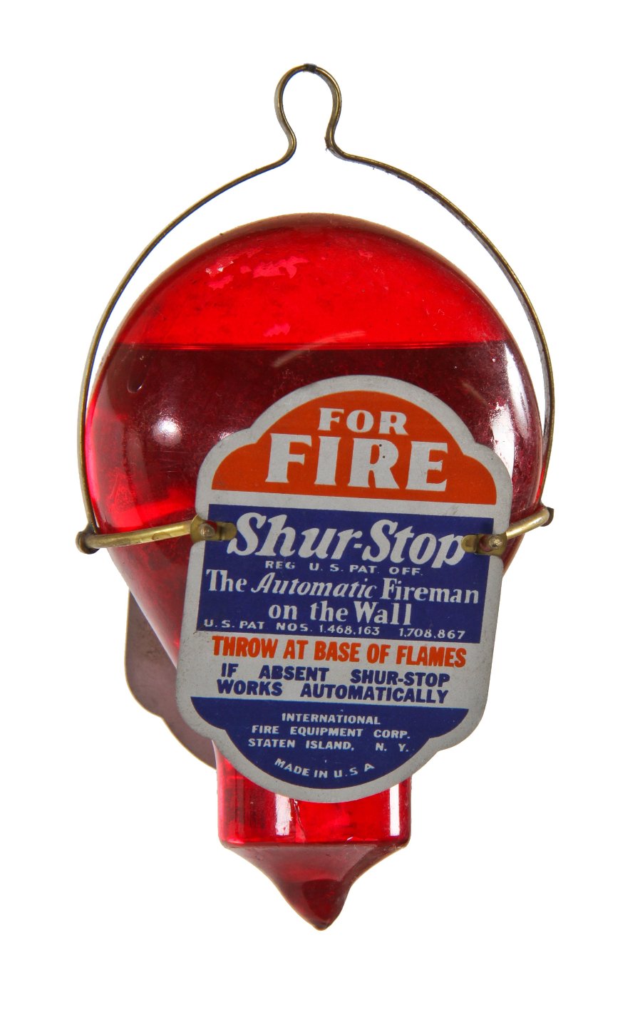 late 1920's original and intact ruby red enameled "automatic fireman on the wall" interior residential hanging fire grenade