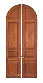 massive pair c. late 1920's original american dark-stained pine interior residential raised panel doors with arched or circle tops