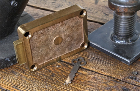 uniquely textured original late 1920's fully functional cast bronze inner walk-in vault door dead lock with original stamped steel flat key
