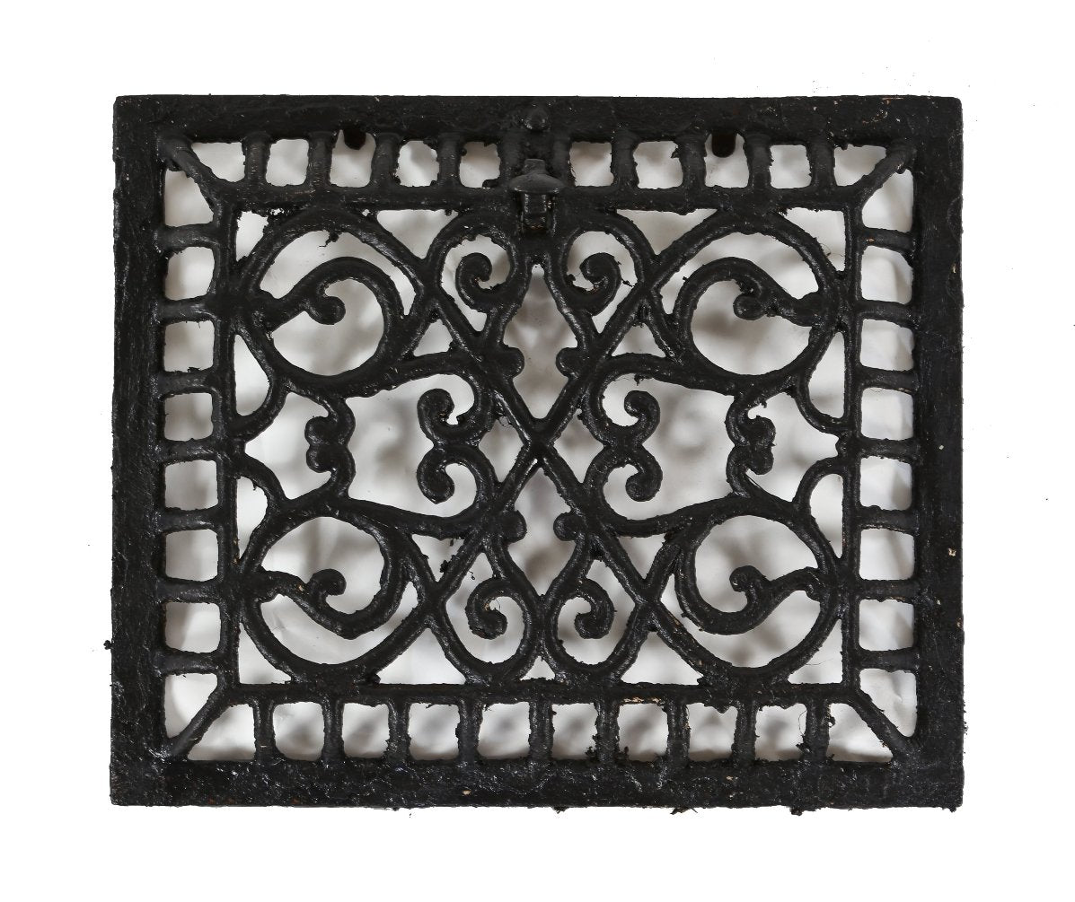 early 20th century black enameled perforated ornamental cast iron interior residential heating register or grate with foliated scrollwork