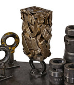 visually distinctive and incredibly heavy single crushed brass metal "briquette" display object consisting of recycled radiator components and/or piping