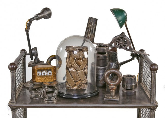 visually distinctive and incredibly heavy single crushed brass metal "briquette" display object consisting of recycled radiator components and/or piping