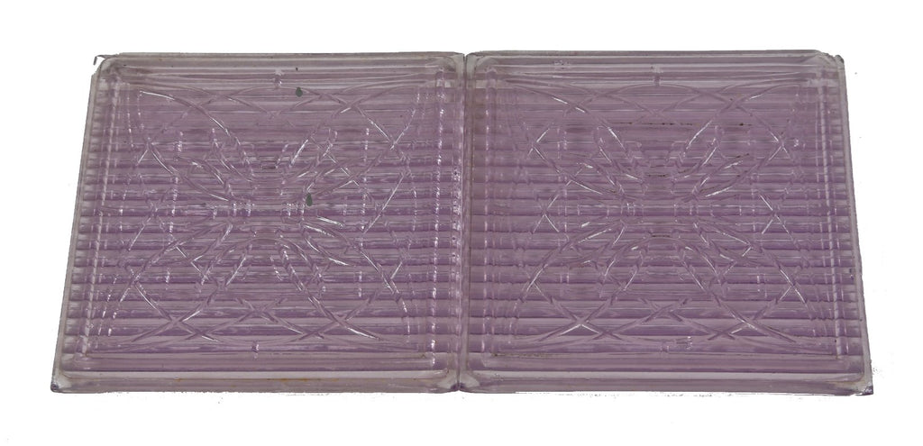 two original early 20th century american frank lloyd wright-designed "sun-purple" ornamented luxfer prism tiles