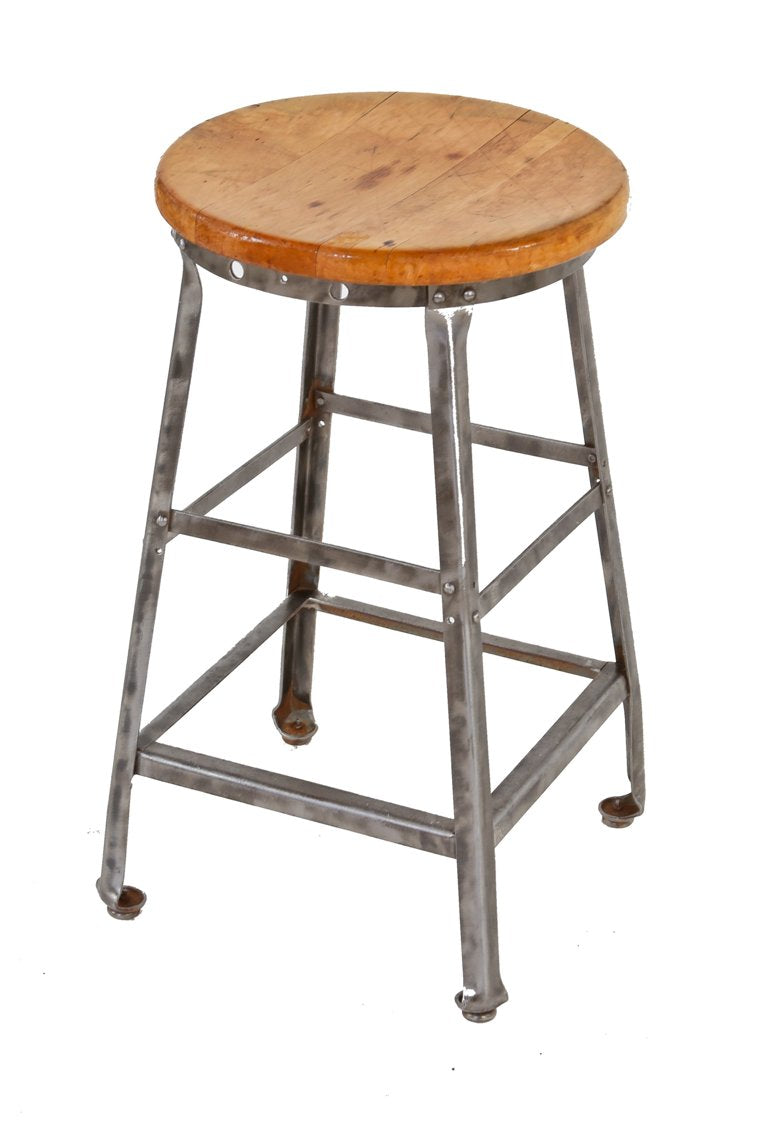 all original c. 1920's american industrial four-legged riveted and welded joint heavy gauge angled steel factory stool with maple wood seat