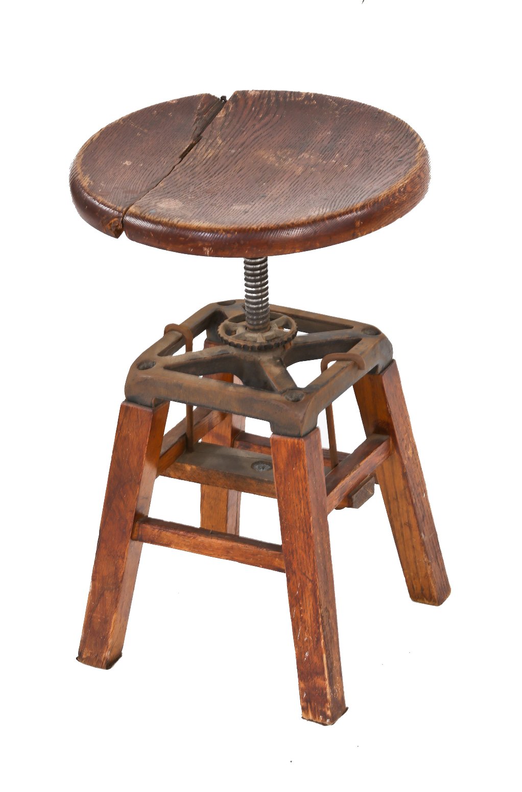 adjustable early 20th century varnished oak wood four-legged stationary low-lying machinist stool with revolving seat