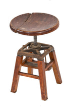 adjustable early 20th century varnished oak wood four-legged stationary low-lying machinist stool with revolving seat
