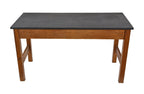 c. 1940's american four-legged interior science laboratory stationary desk comprised of solid oak wood with original black slate tabletop