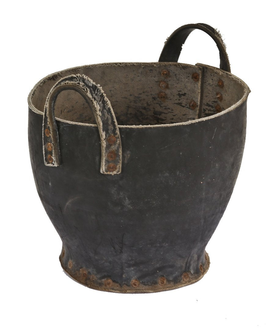 unusual weathered and worn american industrial hardened black rubber portable foundry sand bucket with intact handles