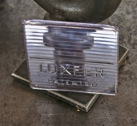 original early 20th century american exterior building facade transom sun-purple-tinted luxfer prism sawtooth glass patent tile