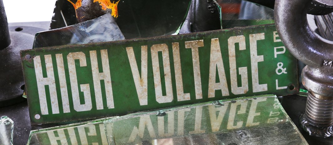 c. 1930's original nicely aged american industrial green and white enameled "high voltage" die cut steel porcelain enameled sign