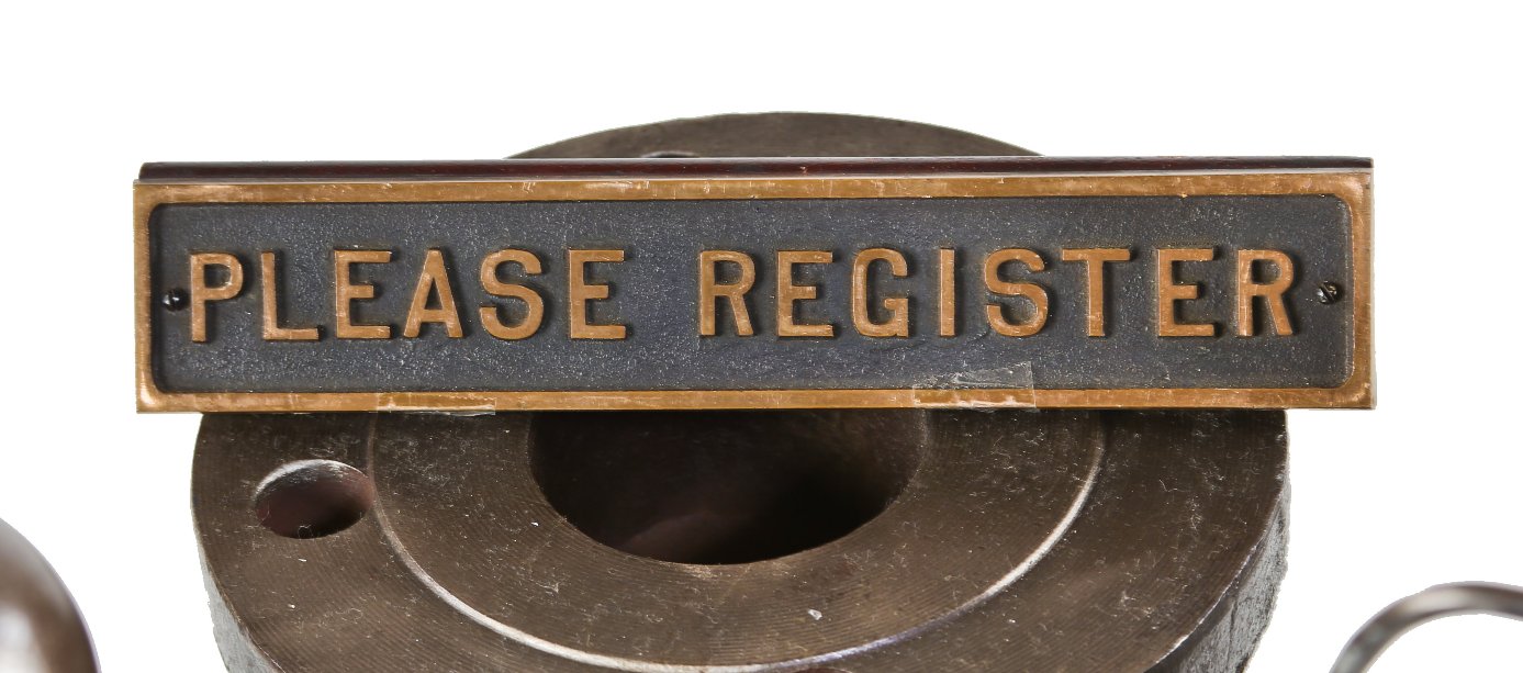 original and intact late 1930's american freestanding hotel desk "please register" cast bronze sign affixed to an angled solid walnut wood base