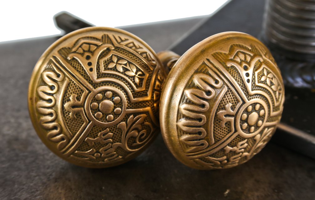 two matching original lightly cleaned antique american "ceylon" pattern interior residential wrought brass dome-shaped doorknobs